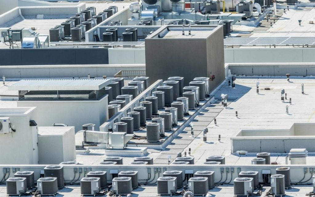 HVAC systems shown atop a large commercial building.